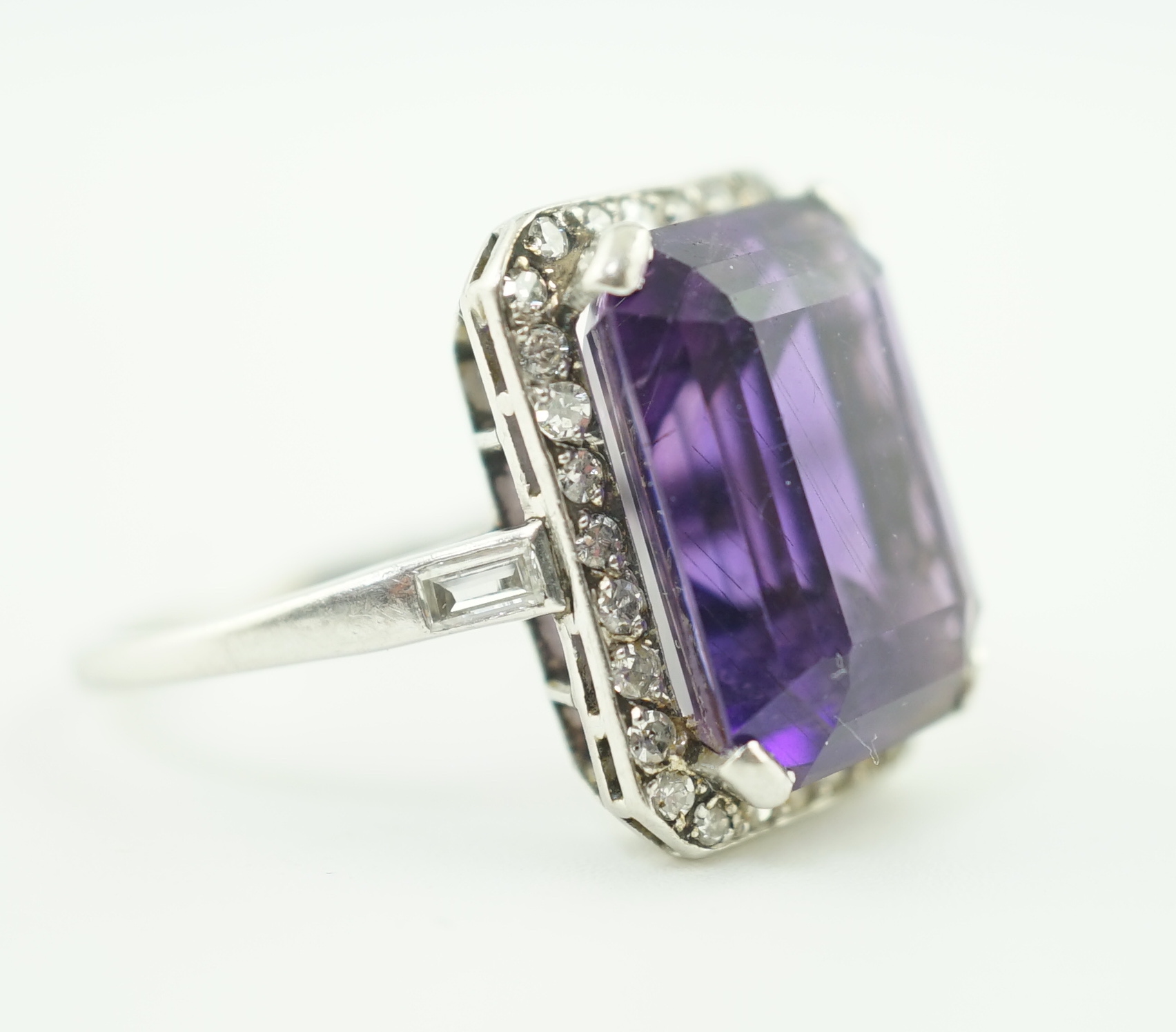 A mid 20th century platinum?, amethyst and diamond set cluster ring